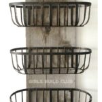 This easy project will help get some clutter off your kitchen or bathroom counter and onto the wall! The rustic wire baskets look great in a country farmhouse styled home or rustic cabin.