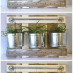 One wall organizer, 3 ways. So many possibilities! Un-clutter your space with this versatile wall organizer diy. It's easy to build from scrap wood and pipe and fits in with a rustic farmhouse decor. Hanging plants, kitchen utensils, or bathroom rack