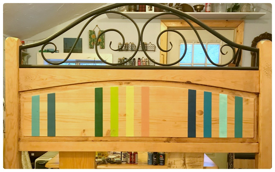 After the first stripes have been painted on the serape headboard.