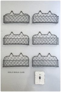 I just hung a bunch of these cute farmhouse wire baskets in my craft room and now they hold all my little bottles of craft paint! Love finding easy cheap ways to de-clutter!