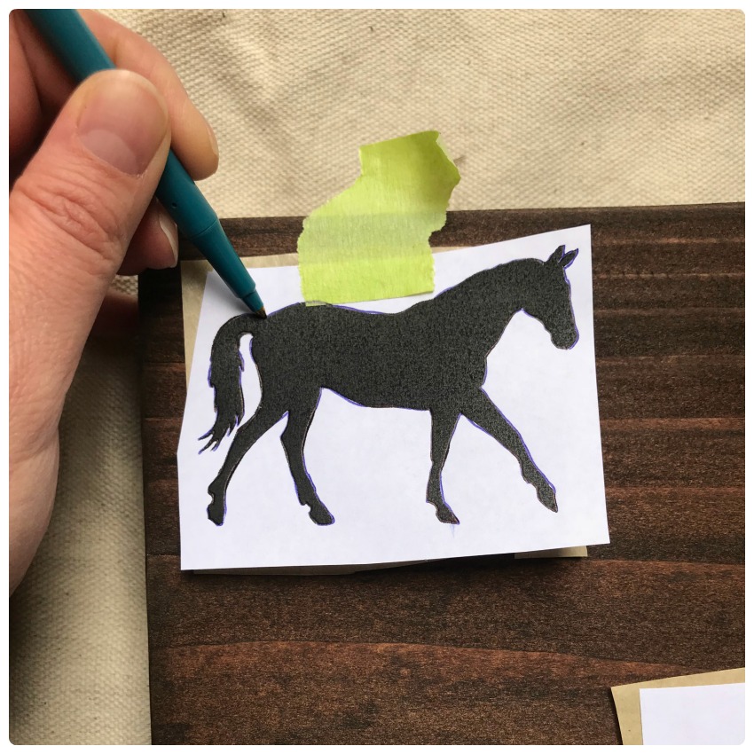 Tracing the horse outline.