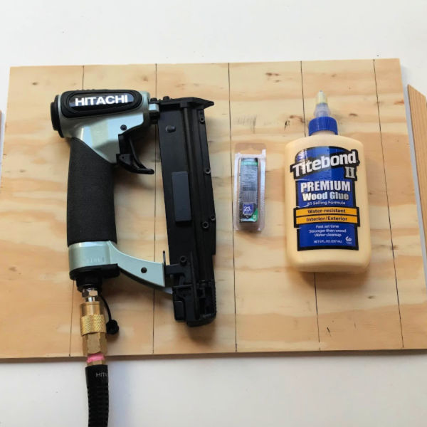 I use both wood glue and pin nailer to secure the wood strips to the backer board on this simple wood mosaic. click through for the diy tutorial.