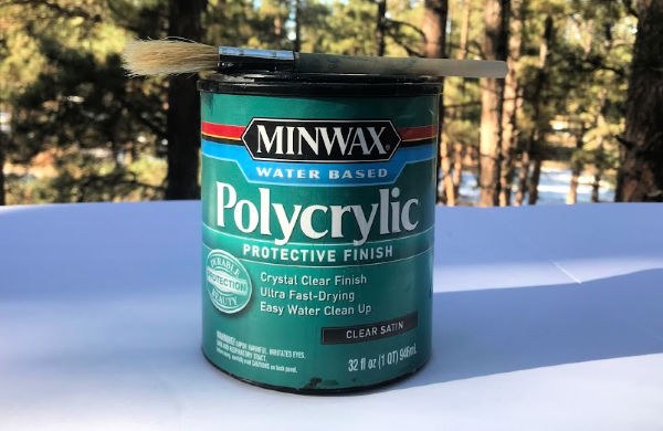 I use Minwax Polycrylic in satin finish to seal my woodworking projects.  It protects the wood from light oil, dirt, moisture and makes it easier to wipe clean with soap and water.