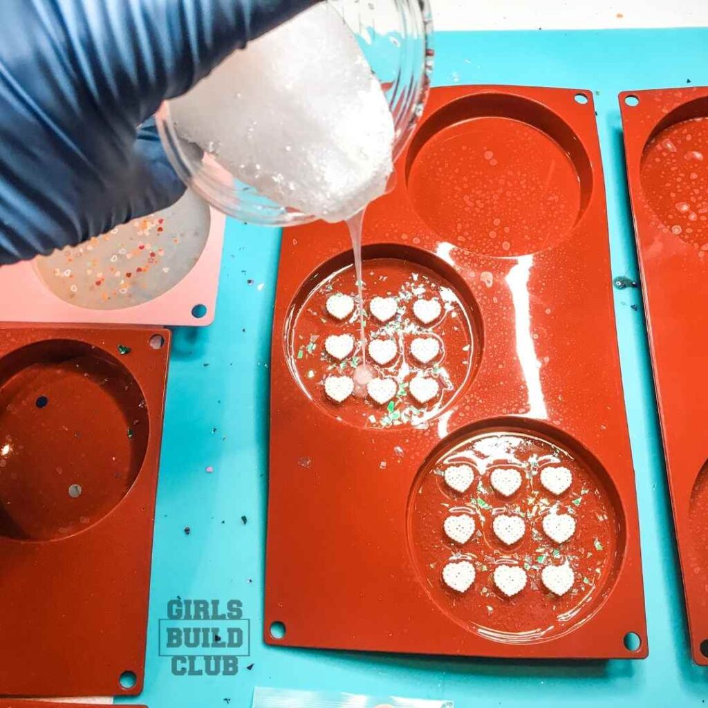 Pour the rest of the resin over the candy.